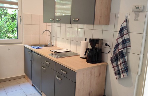 Hagen Apartment | Charming house within a house - vacation & business apartment with private terrace.