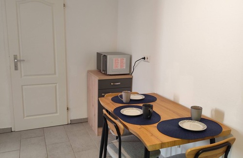 Hagen Apartment | Charming house within a house - vacation & business apartment with private terrace.