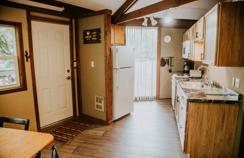 Puposky Cabin | Charming Up North Octagon Cabin - Private Beach & Resort Amenities