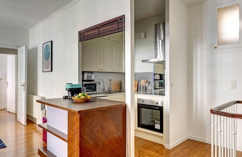 8th Arrondissement Apartment | Chic 2BR with Balcony near Arc de Triomphe