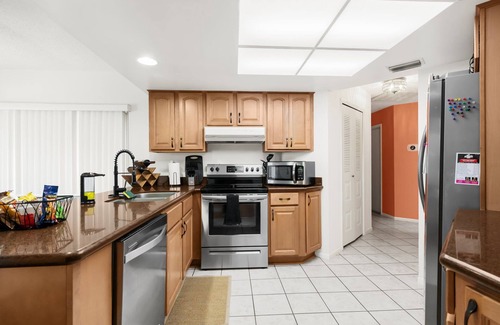 Spring Hill House | Clean, spacious home with heated pool near Weeki Wachi Springs!