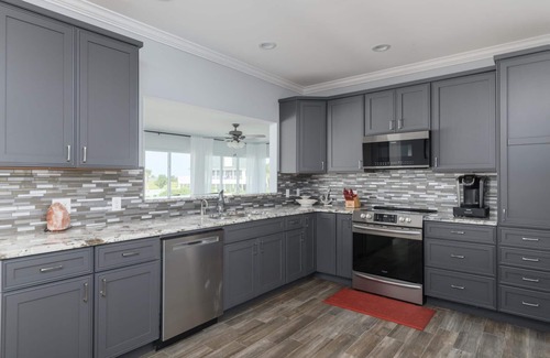 Beachwalk House | Coastal Home with Screened In Porch & Access to Harbor Island Amenities