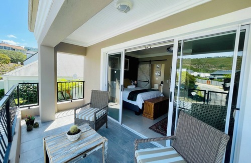 Plettenberg Bay Apartment | Coastal Studio Suite in Plettenberg Bay: Private Terrace, Art & Views