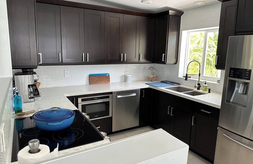 Tavernier House | Coconut Hut Oasis - 3 Bedroom Waterfront home with Pool/Spa, Tiki Hut, and Dock