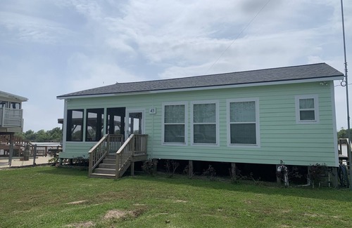 Matagorda Cottage | Comfortable Two Bedroom on the river, WIFI, Lighted Pier with beautiful sunsets!