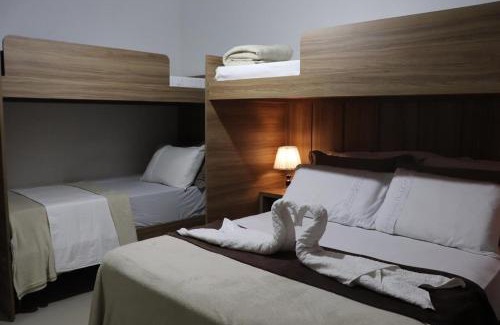 Praia do Morro Apartment | CONFORTO IMBATIVEL - 25 metros do MAR - 2 Quartos com AR CONDICIONADOS SPLIT, Air Fryer, WI-FI, Disney Plus, Star Plus, HBO Max, Guarda Sol, Cadeiras de Praia e Caixa Térmica - 8 pessoas com Muito Conforto - Melhor Localização!