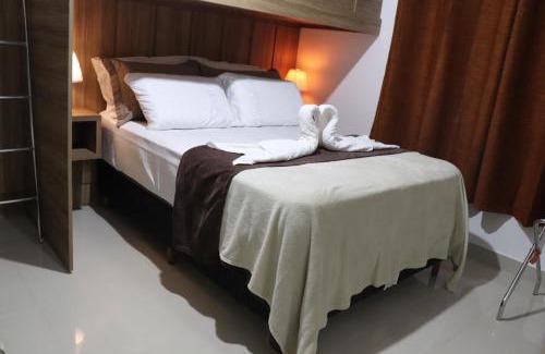 Praia do Morro Apartment | CONFORTO IMBATIVEL - 25 metros do MAR - 2 Quartos com AR CONDICIONADOS SPLIT, Air Fryer, WI-FI, Disney Plus, Star Plus, HBO Max, Guarda Sol, Cadeiras de Praia e Caixa Térmica - 8 pessoas com Muito Conforto - Melhor Localização!