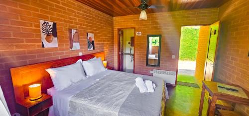 Santo Antonio do Pinhal Hotel | Cores e Flores da Serra Pousada by Concavus