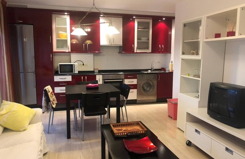 Puebla del Caraminal Apartment | Cosy apartment with colourfully decorated and brightly lit living room