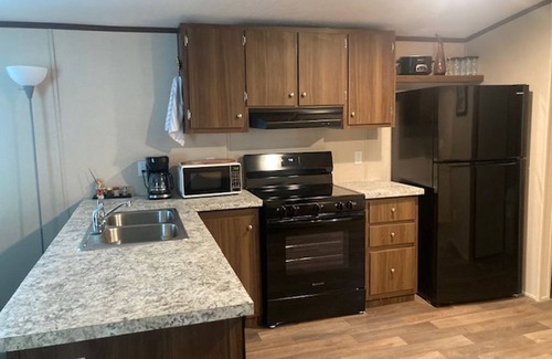 Parks House | Country living in 2 bedroom mobile home surrounded by ponds, woods, wildlife