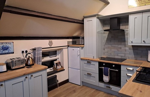 Waren Mill House | Cove Cottage - charming quiet barn conversion near the sea Budle Bay, Waren Mill