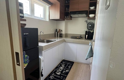 San Bartolome Condo | Cozy 1-bedroom condo with AC and WiFi in enjoyable Quezon City