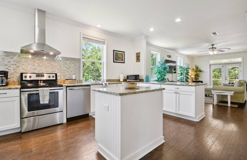 Henderson Point House | Cozy cottage surrounded by woods and just a short walk to the beach!