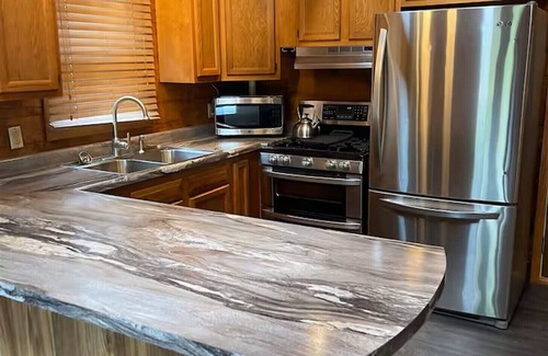 Coal Valley Cabin | Cozy Log Cabin overlooking a pond with a fire pit, game area and rustic charm