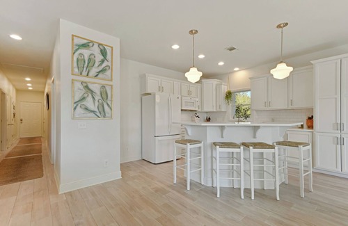 Henderson Point Cottage | Cozy Raised Cottage Overlooking Beautiful Bayou Mallini.