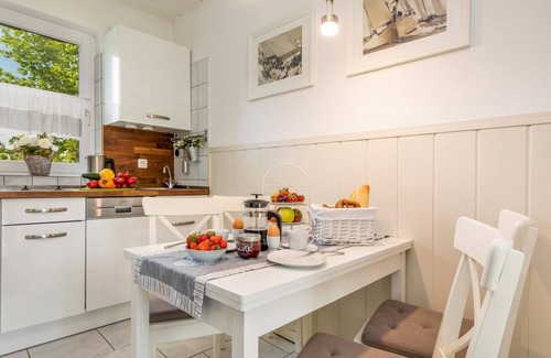 Zingst Apartment | Cozy vacation apartment on the Baltic Sea in the green, with fireplace and sauna.