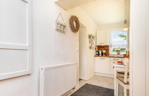Zingst Apartment | Cozy vacation apartment on the Baltic Sea in the green, with fireplace and sauna.