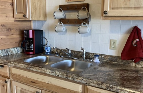 Norfork Cottage | Cozy White River Cabin, perfect for a couple's getaway or fishing trip!