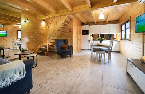 Lubrza House | Create lasting vacation memories in this inviting cottage near the lake.