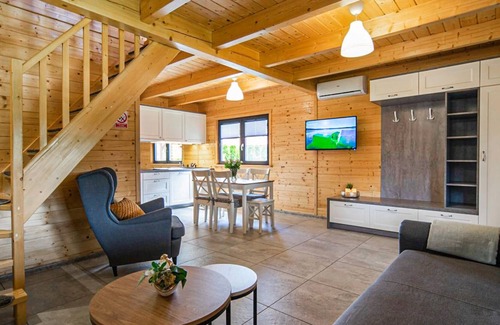 Lubrza House | Create lasting vacation memories in this inviting cottage near the lake.