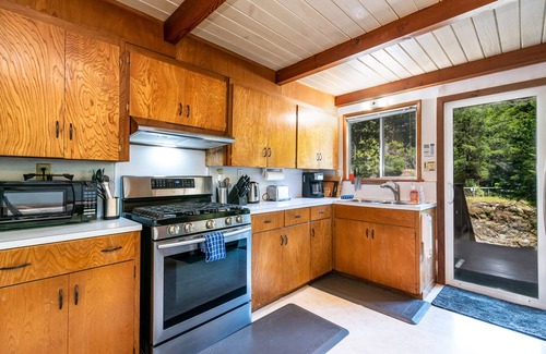 Cazadero House | Creek-front Dreamwood cabin with deck, WiFi, wood-burning stove & private sauna