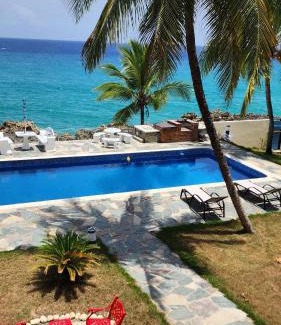 Playa Chiquita Villa | Crimson beach ocean front entire floor villa