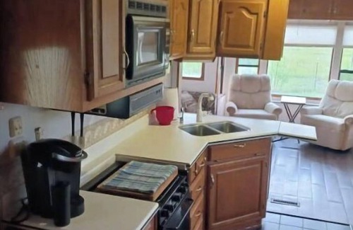 Madison House | Delightful 5th wheel w/ queen bed, patio deck, and high speed internet.