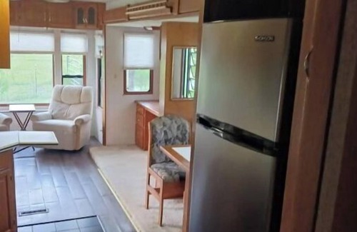 Madison House | Delightful 5th wheel w/ queen bed, patio deck, and high speed internet.