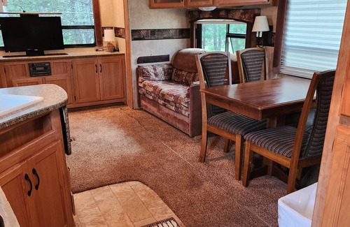 Nevis RV Rental | Deluxe Camper at a RV park