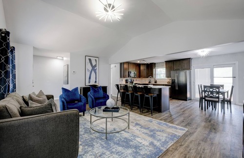 Fairburn Apartment | Discover your ideal Georgia retreat in this fully renovated, 3-bedroom ranch-style Retreat that sleeps 8. Enjoy a spacious master suite, an open-concept kitchen with modern appliances, and chic décor throughout.