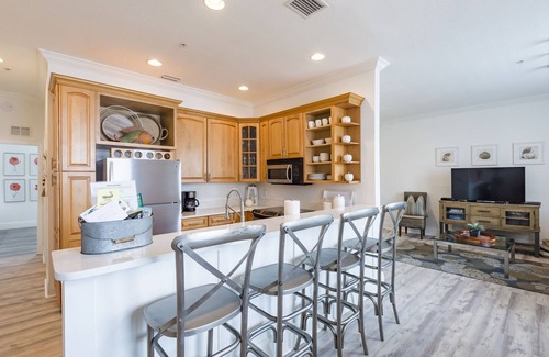 Clearwater Beach Condo | Dock of the Bay-Coastal Elegance! Waterfront Views, Pool, Dock, Walk Everywhere