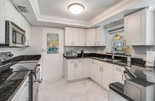 East Naples House | Dog-friendly lakefront home with hot tub, gazebo, firepit, outdoor kitchen, W/D