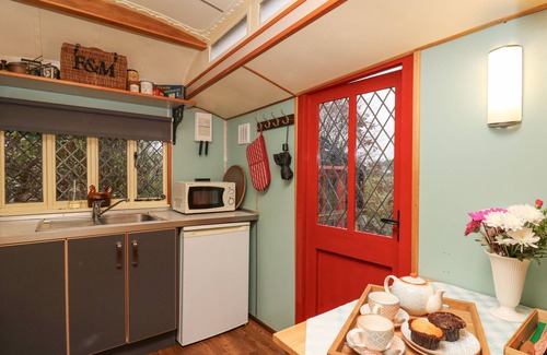 Tan-y-groes Cottage | DOLLY THE CIRCUS WAGON, pet friendly, with open fire in Brynhoffnant