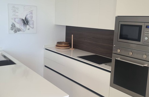 New Golden Mile Apartment | Dominion Beach Ground floor app. with garden 6 people directly by the sea and swimming pool