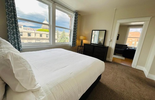 Boise Apartment | Downtown Digs-View of the City! Stay above local restaurants and nightlife, posh amenities heated toilet seat, oversized rain shower head in glass shower, in-unit laundry, one garage parking spot