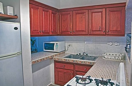 El Batey Apartment | Downtown guest-friendly condo steps from sandy beach!