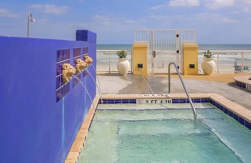 Ormond Shores Condo | Enjoy the sands of the Atlantic in this tropical 2BD condo with resort amenities for family