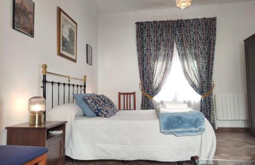 Carmona Apartment | Entretorres. Casa-dúplex en centro histórico.