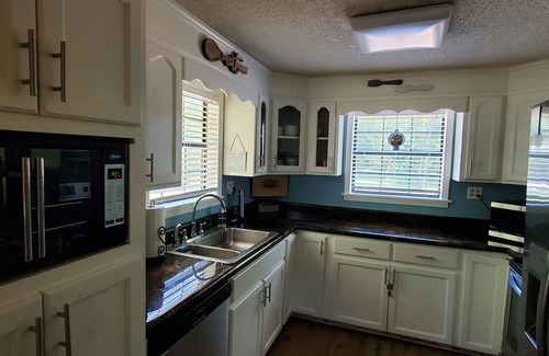 Lucedale Cabin | Escape City Life at this Exceptional Cabin Retreat with River Views.