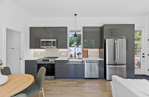 Young Harris Apartment | Escape to a 2BR/1BA tiny home in the North Georgia mountains. Create meals in the chef’s kitchen, cozy up by the wood-burning stove, refresh in the spa-style shower, and enjoy crisp mountain air and brilliant fall colors from your private deck.