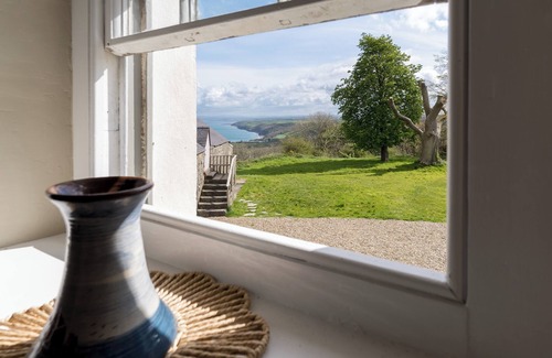 New Quay House | Escape to Panteg, a charming coastal retreat that blends traditional character with modern comfort,