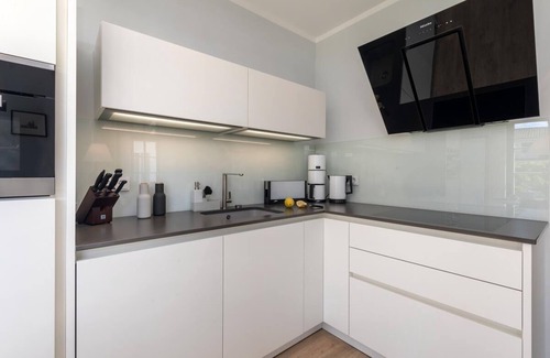 Zingst Apartment | Exclusive apartment in central location with garden, fireplace, WLAN, PS5, FIFA25, karaoke