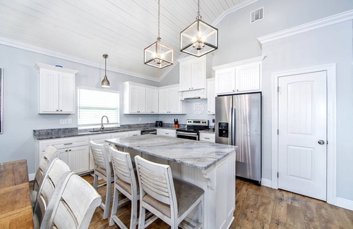 Golden Meadow House | Experience waterfront living at The Pointe in Grand Isle, LA, with 4 bedrooms and boat access.