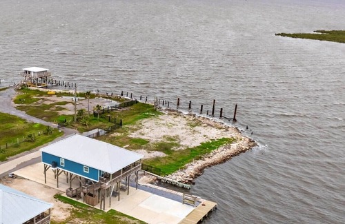 Golden Meadow House | Experience waterfront living at The Pointe in Grand Isle, LA, with 4 bedrooms and boat access.