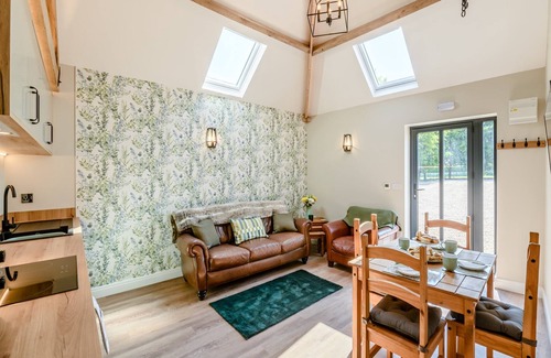 Arnold Cottage | Exposed beams and calming green colours for this holiday home.