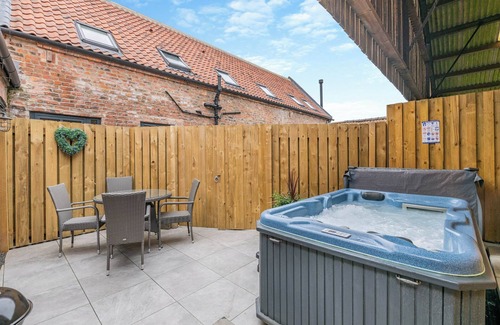 Arnold Cottage | Exposed beams and calming green colours for this holiday home.