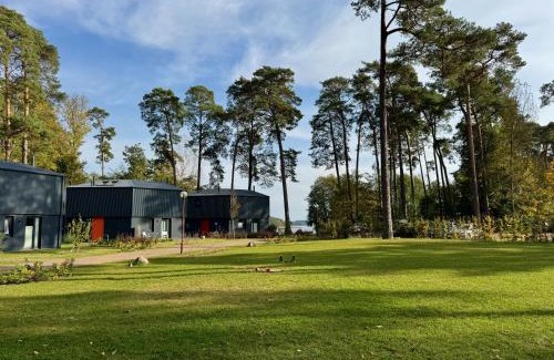 Postheim House | Ferienhaus Haus 11 in Templin mit Seeblick und Sauna
