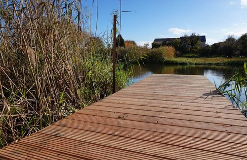 Bad Freienwalde Apartment | Fewo EG am Fluss mit Terrasse - Eine Grüne Oase