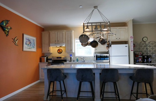 Cambridge House | Fish, kayak, bike, and more at this private serene 24-acre waterfront estate.