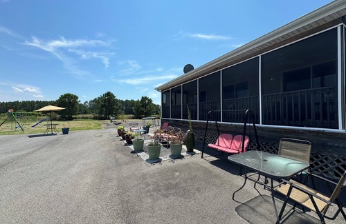 Cambridge House | Fish, kayak, bike, and more at this private serene 24-acre waterfront estate.